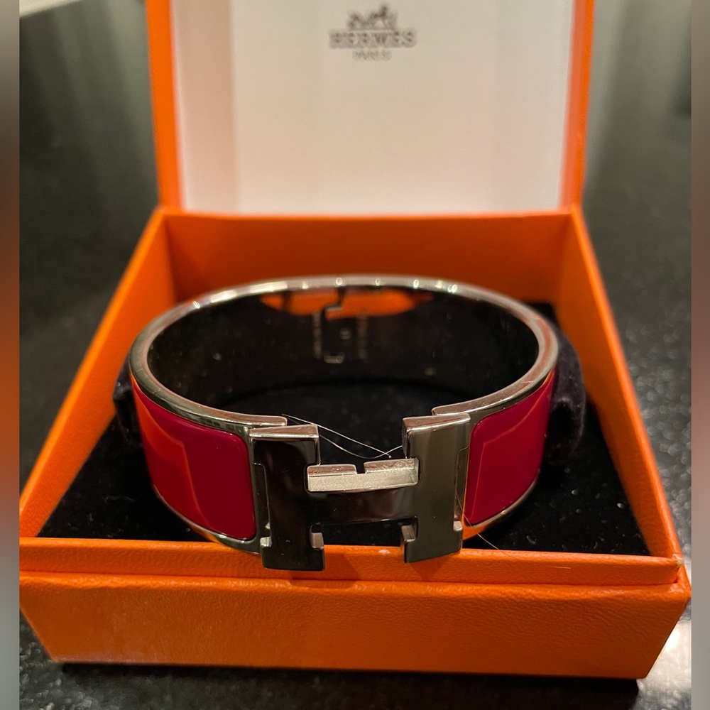 Hermes Clic Clac wide bracelet in red and silver.